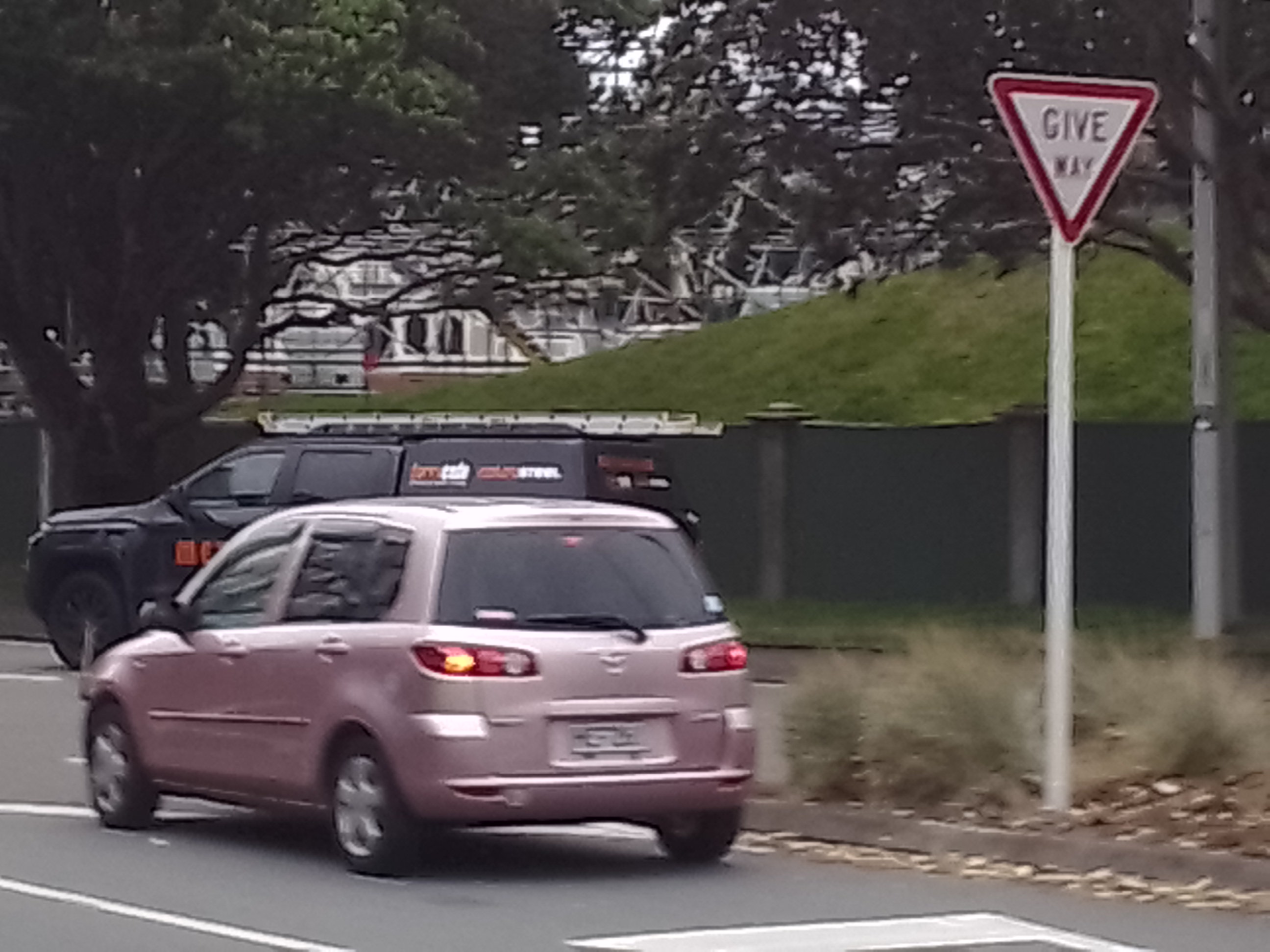 Little pink mazda demio going around the basin reserve
